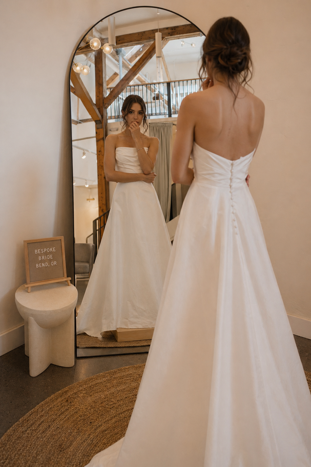 bride looks contemplative, torn between two dresses